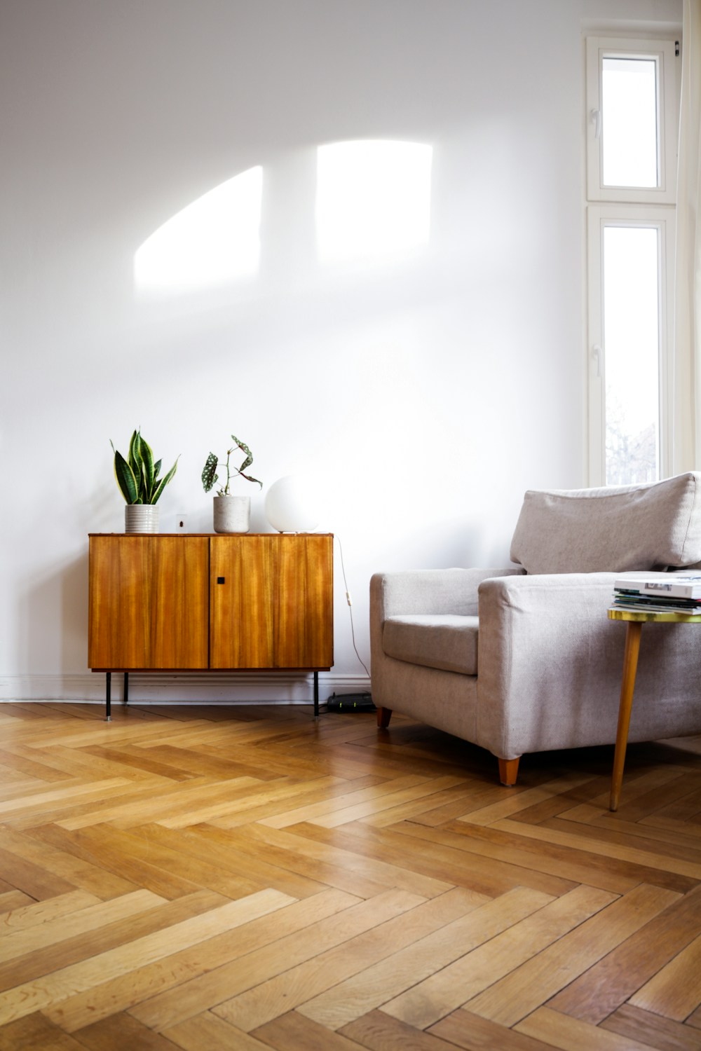 Sunlit interior with natural wood furniture and plants, shown in a sample business website